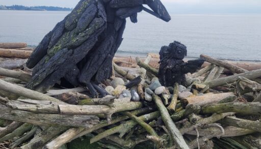 a driftwood sculpture of a raven